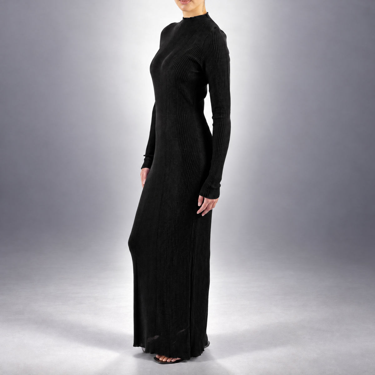 STANDISH. Doreen Maxi Dress in Carbon Black, a knit maxi dress, worn, side view #color_carbon black