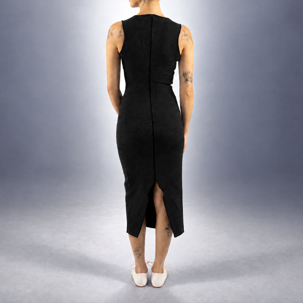 STANDISH. Evie Dress in Carbon Black, a knit dress, worn, back view #color_carbon black