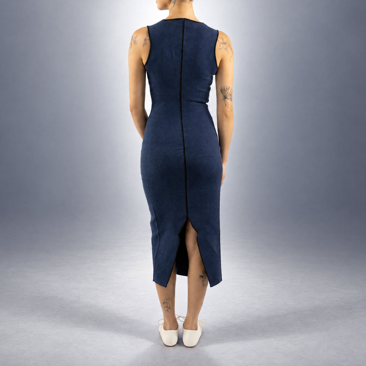 STANDISH. Evie Dress in Ink Navy, a knit dress, worn, back view #color_ink navy