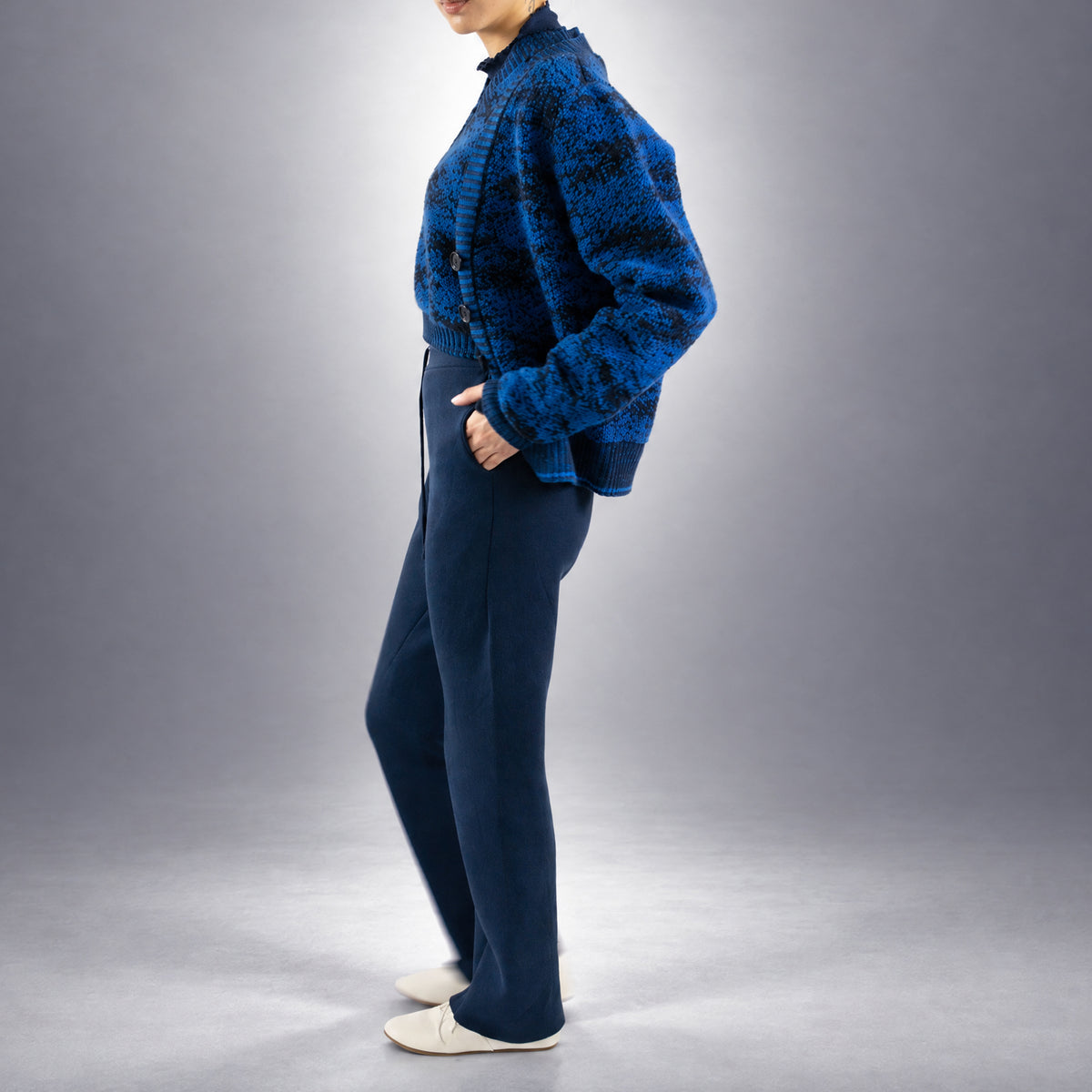 STANDISH. Julie Cardigan in Lapping Blue/Midnight Navy Jacquard, a knit cardigan, worn, side view #color_lapping blue/midnight navy jacquard