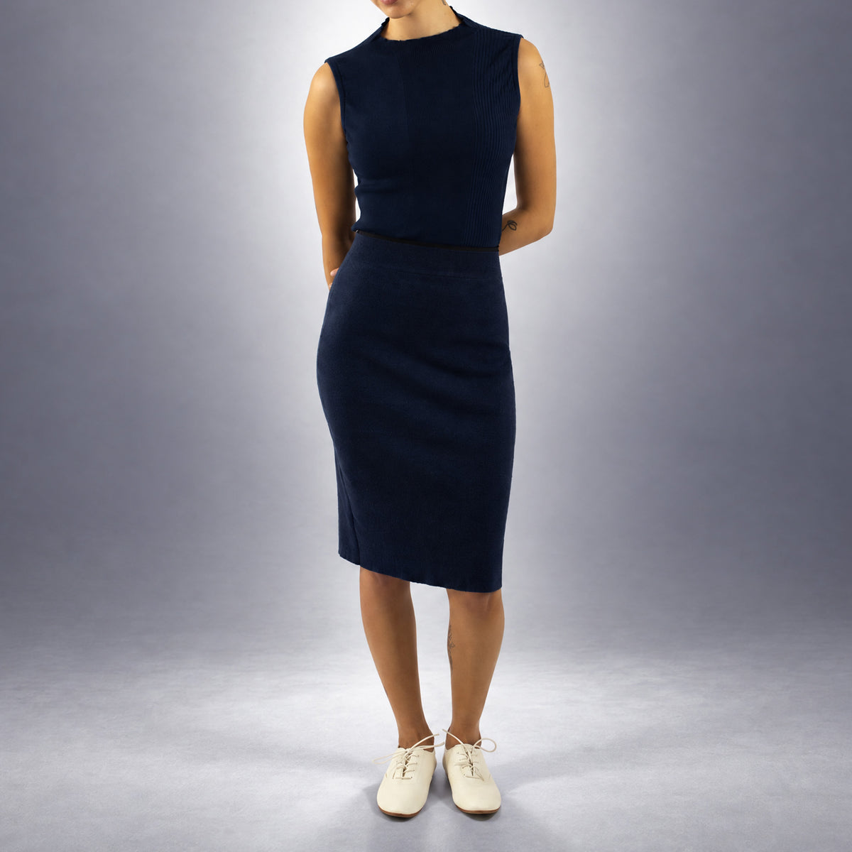 STANDISH. Mickey Skirt in Ink Navy, a knit skirt, worn, front view #color_ink navy