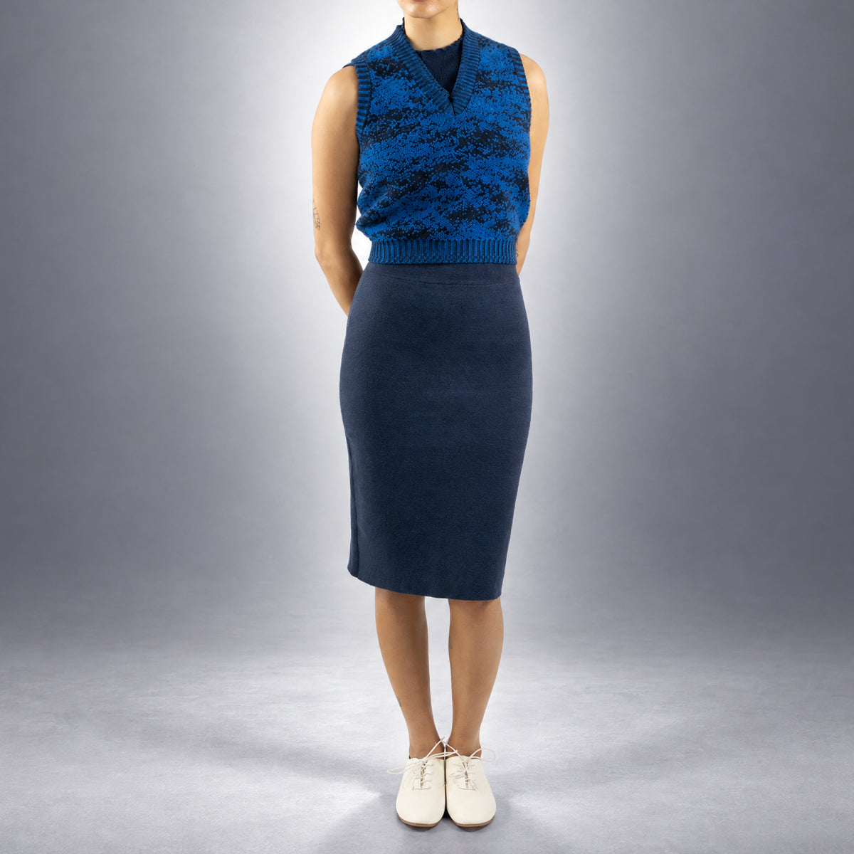 STANDISH. Paula Vest in Lapping Blue/Midnight Navy Jacquard, a knit vest, worn, front view #color_lapping blue/midnight navy jacquard