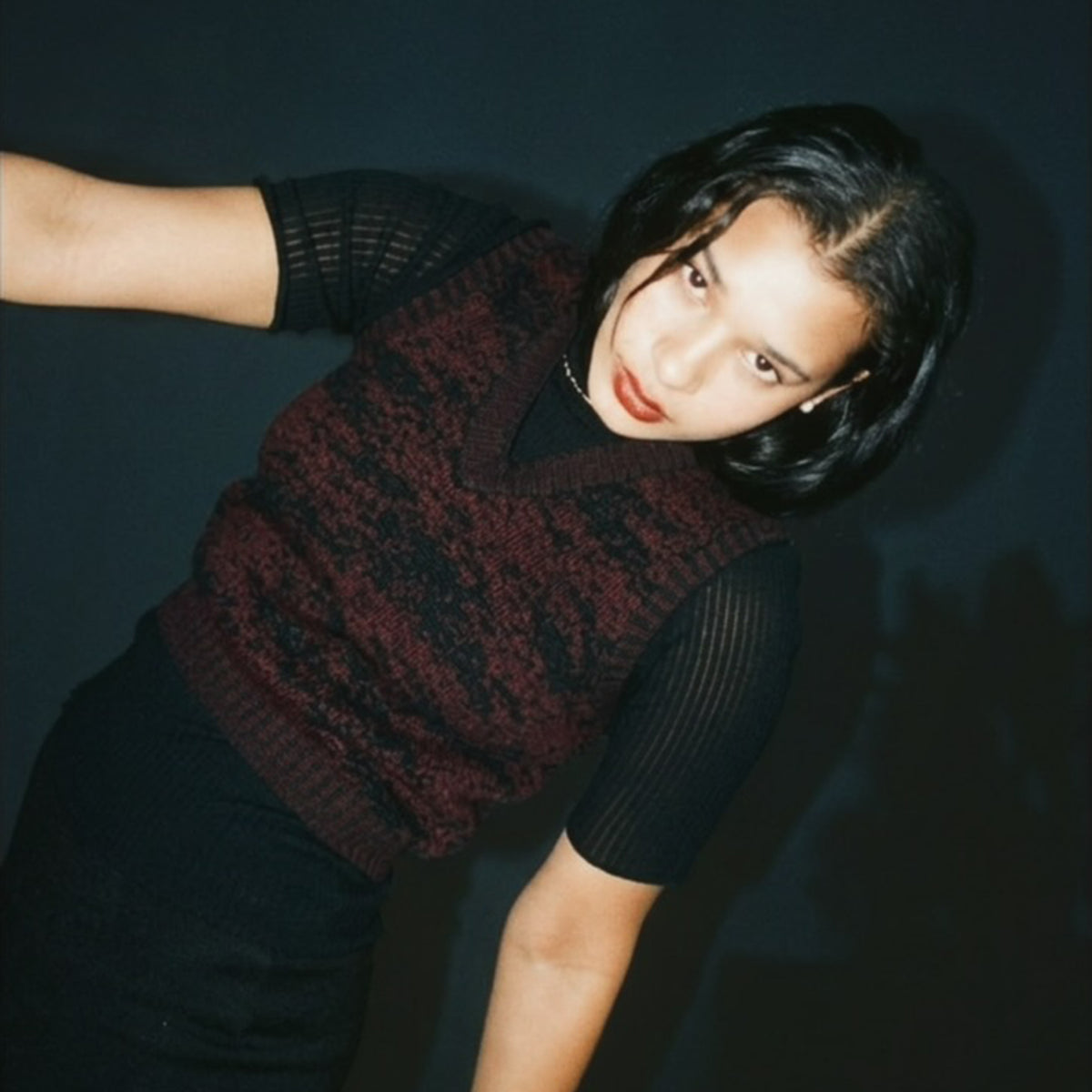 STANDISH. Paula Vest in Nocturne Magenta/Carbon Black Jacquard, a knit vest, styled editorial shot #color_nocturne magenta/carbon black jacquard