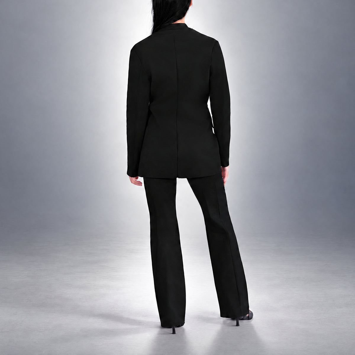 STANDISH. Dolores Blazer in Carbon Black, a knit blazer, worn, back view #color_carbon black