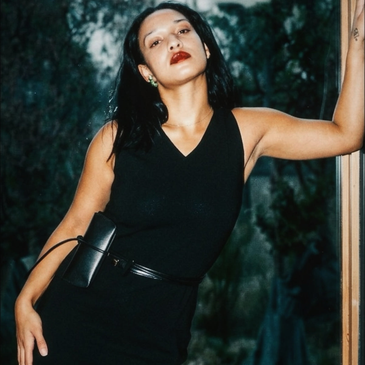 STANDISH. Evie Dress in Carbon Black, a knit dress, styled editorial shot #color_carbon black
