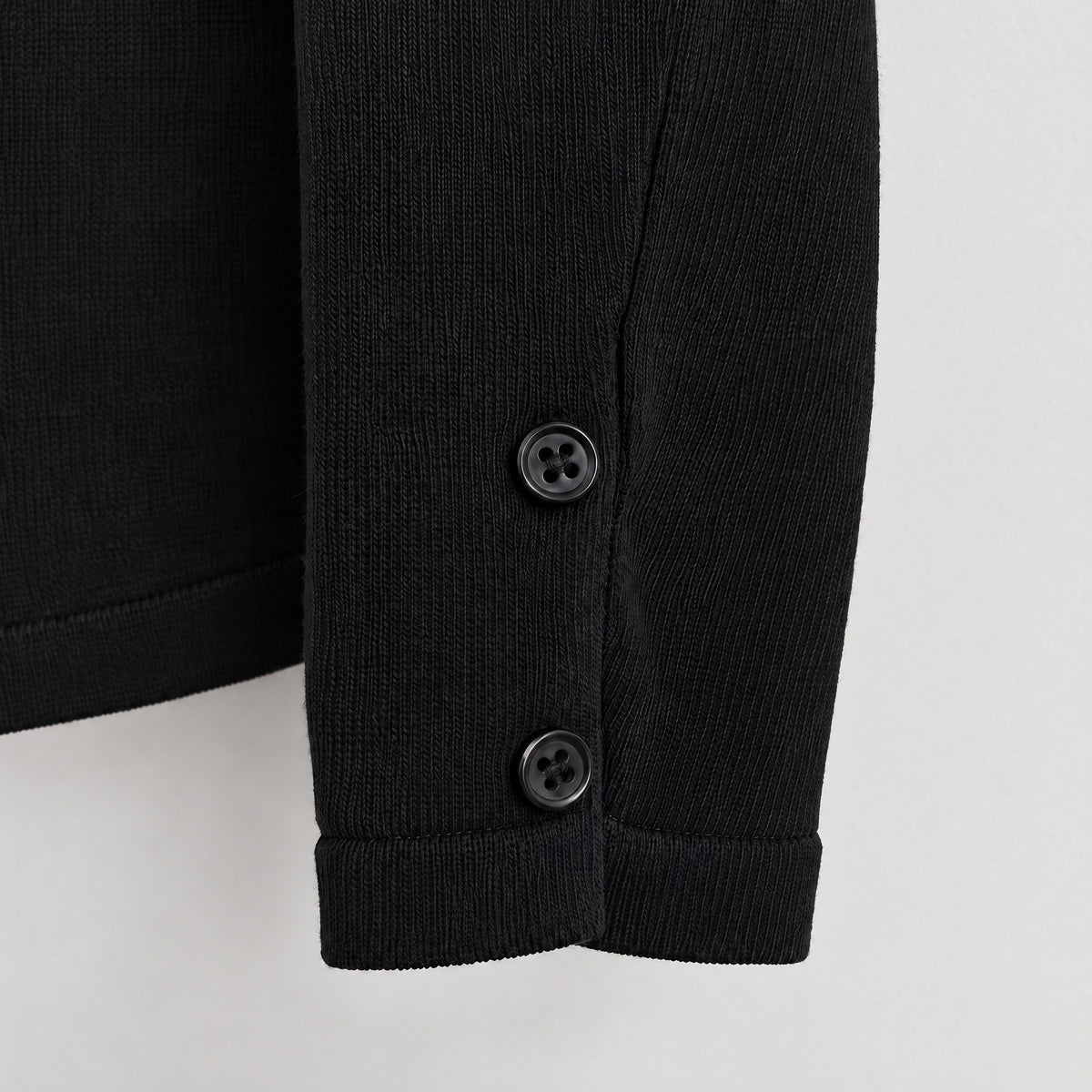 STANDISH. Gail Shirt in Carbon Black, close-up of the Organic Italian cotton knit cuff #color_carbon black