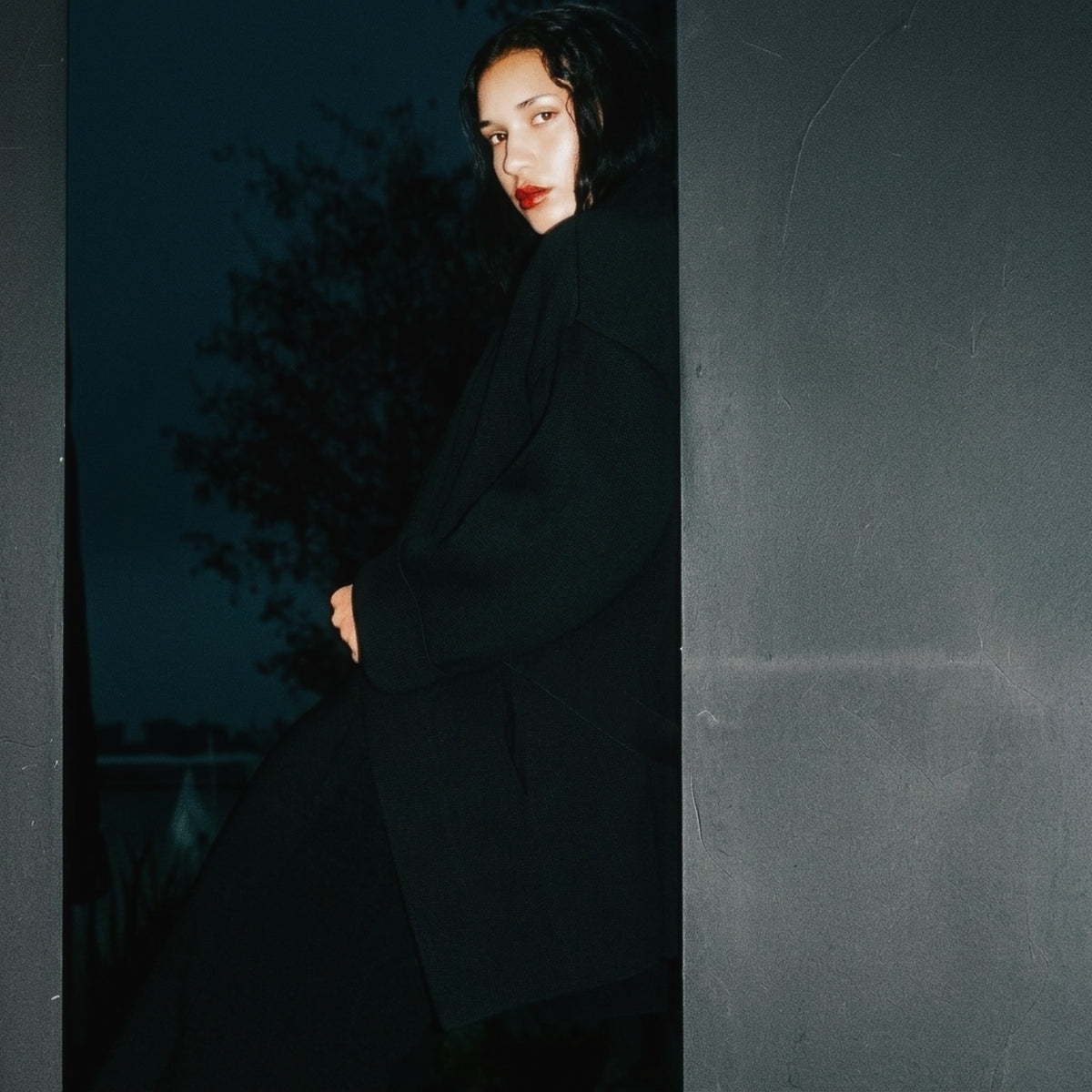 STANDISH. Jessica Coat in Carbon Black, a knit coat, styled editorial shot #color_carbon black