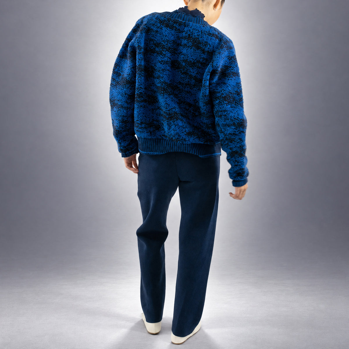 STANDISH. Julie Cardigan in Lapping Blue/Midnight Navy Jacquard, a knit cardigan, worn, back view #color_lapping blue/midnight navy jacquard