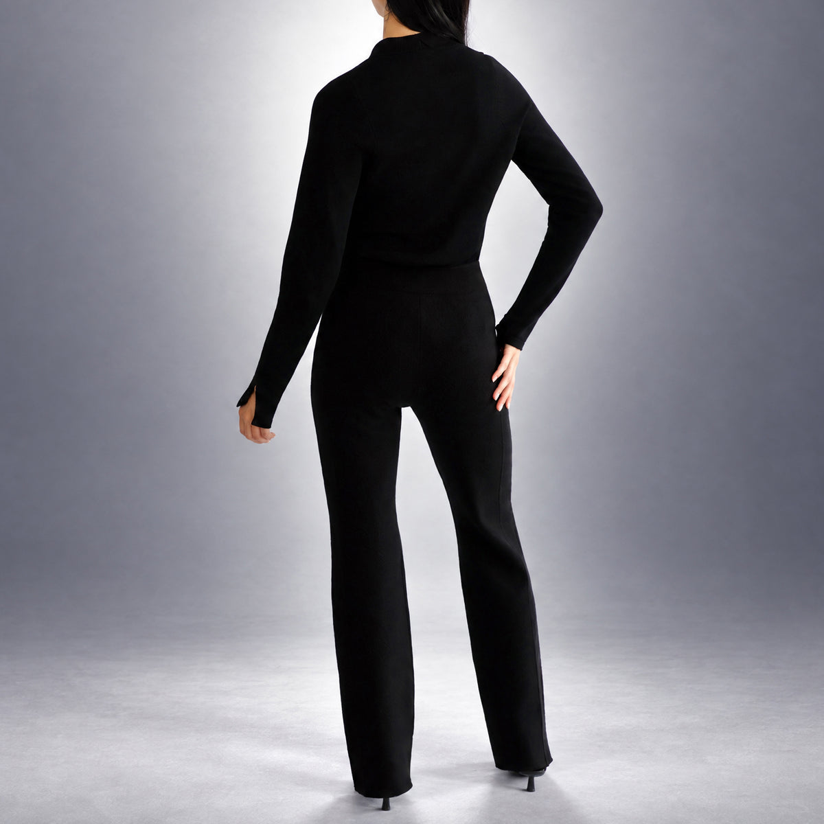 STANDISH. Lola Pant in Carbon Black, a knit pant, worn, back view #color_carbon black