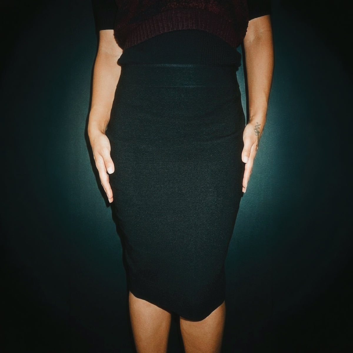 STANDISH. Mickey Skirt in Carbon Black, a knit skirt, styled editorial shot #color_carbon black