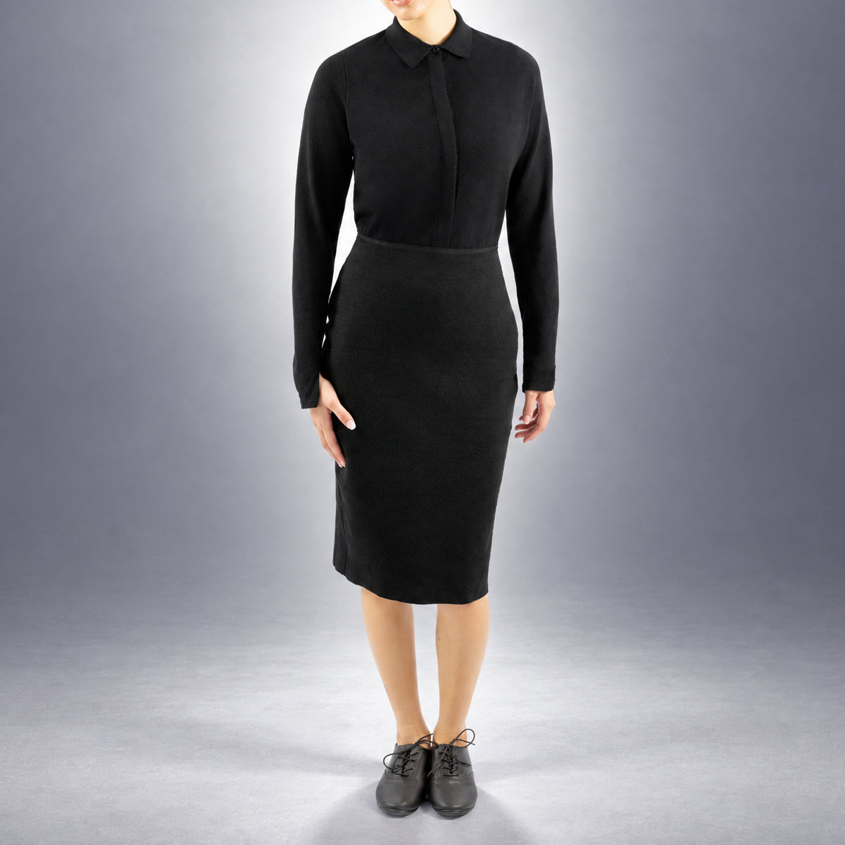 STANDISH. Mickey Skirt in Carbon Black, a knit skirt, worn, front view #color_carbon black