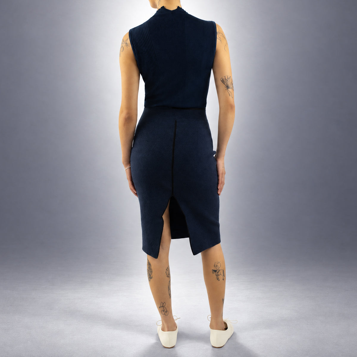 STANDISH. Mickey Skirt in Ink Navy, a knit skirt, worn, back view #color_ink navy