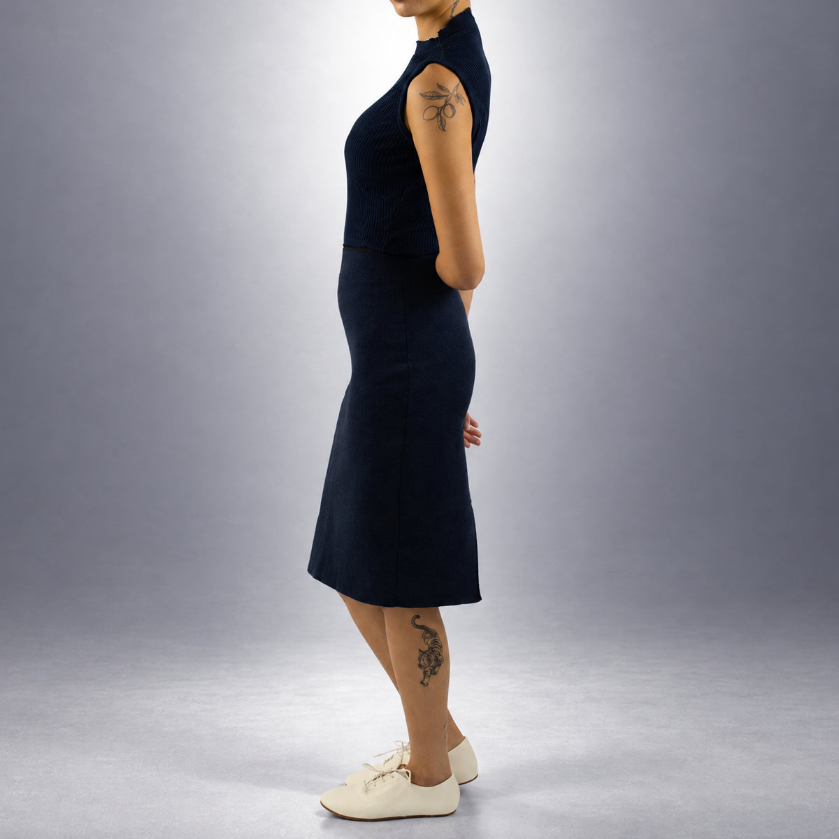 STANDISH. Mickey Skirt in Ink Navy, a knit skirt, worn, side view #color_ink navy