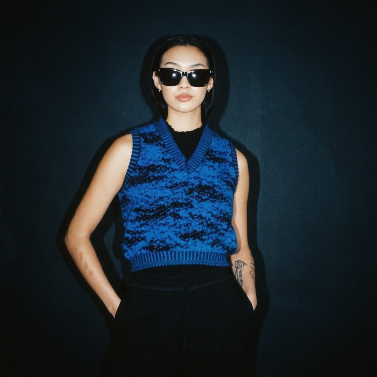 STANDISH. Paula Vest in Lapping Blue/Midnight Navy Jacquard, a knit vest, styled editorial shot #color_lapping blue/midnight navy jacquard