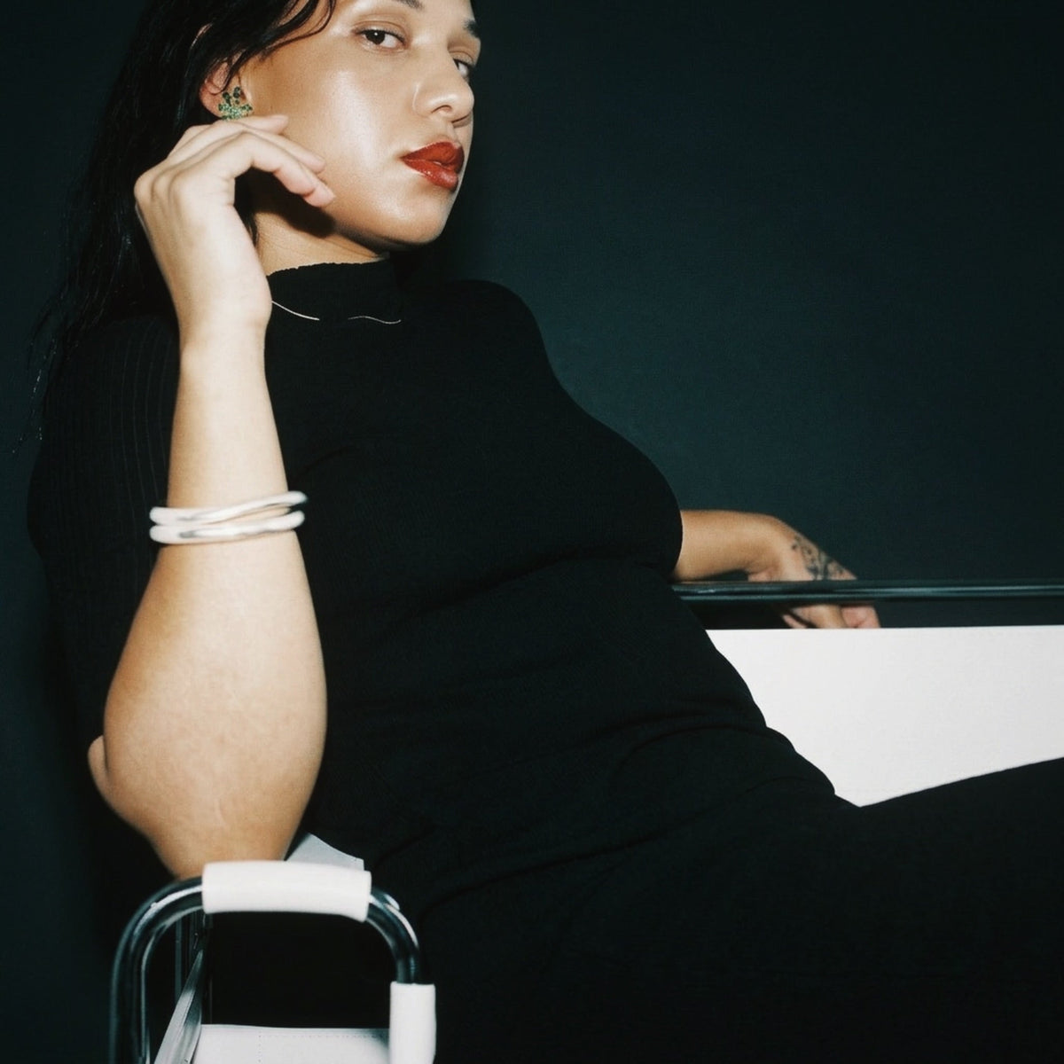 STANDISH. Rhea Top in Carbon Black, a knit top, styled editorial shot #color_carbon black