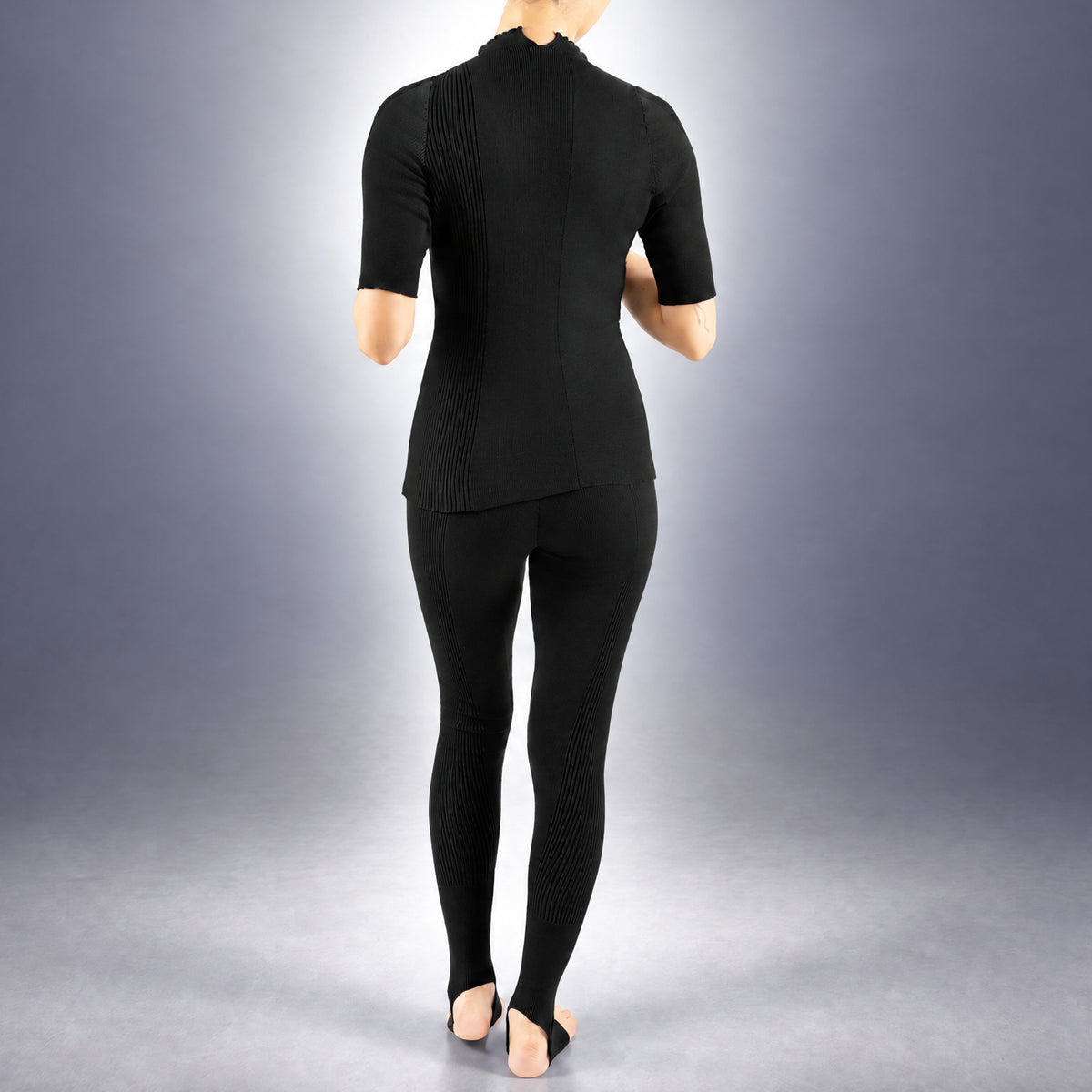 STANDISH. Rhea Top in Carbon Black, a knit top, worn, back view #color_carbon black