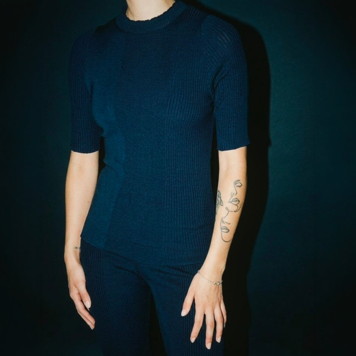 STANDISH. Rhea Top in Ink Navy, a knit top, styled editorial shot #color_ink navy