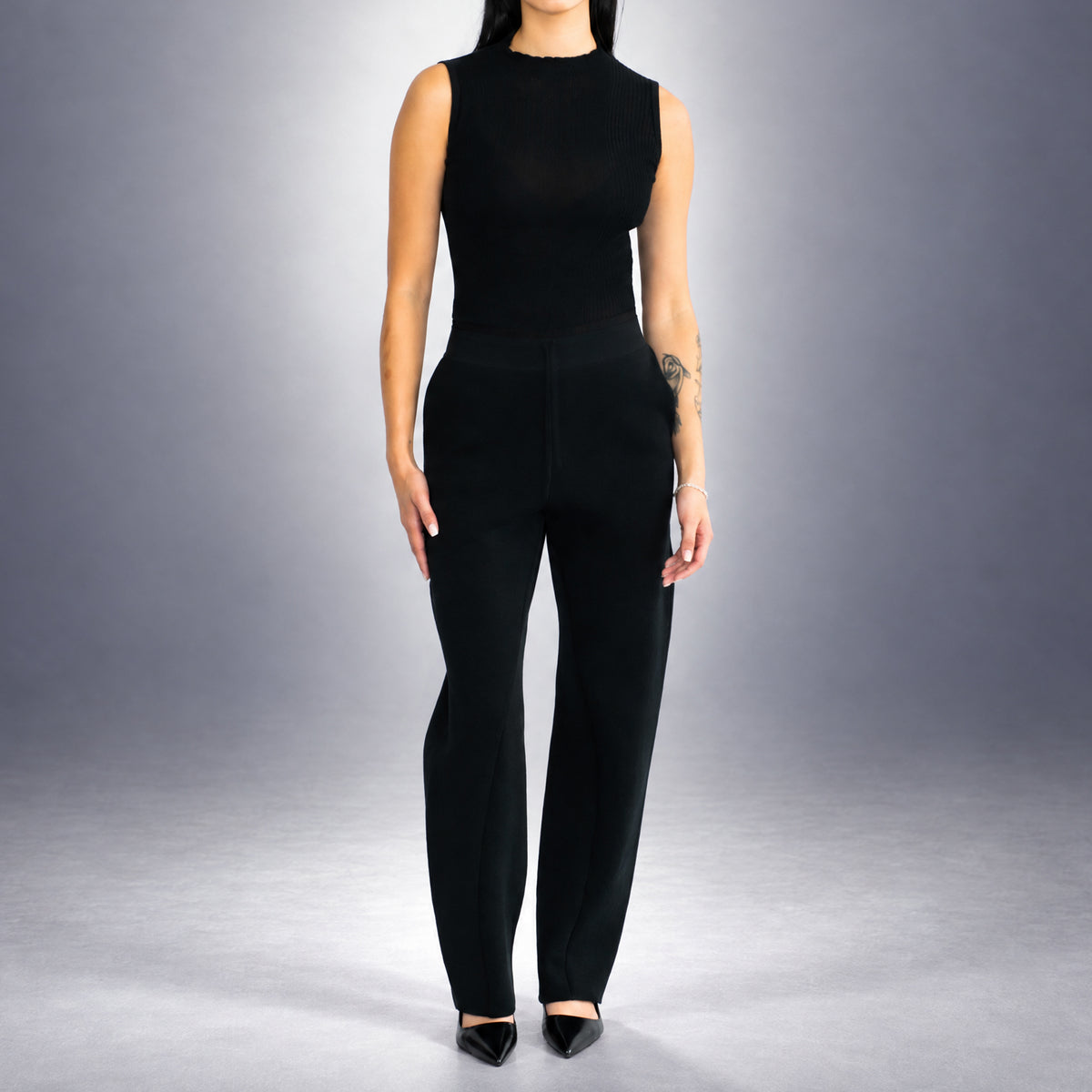 STANDISH. Suzy Track Pant in Carbon Black, a knit track pant, worn, front view #color_carbon black